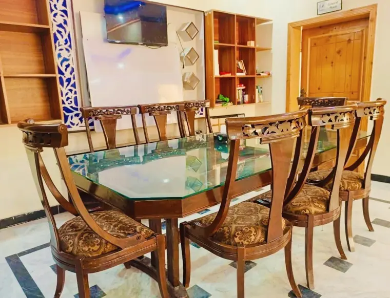 Dining room with a large carved wooden table