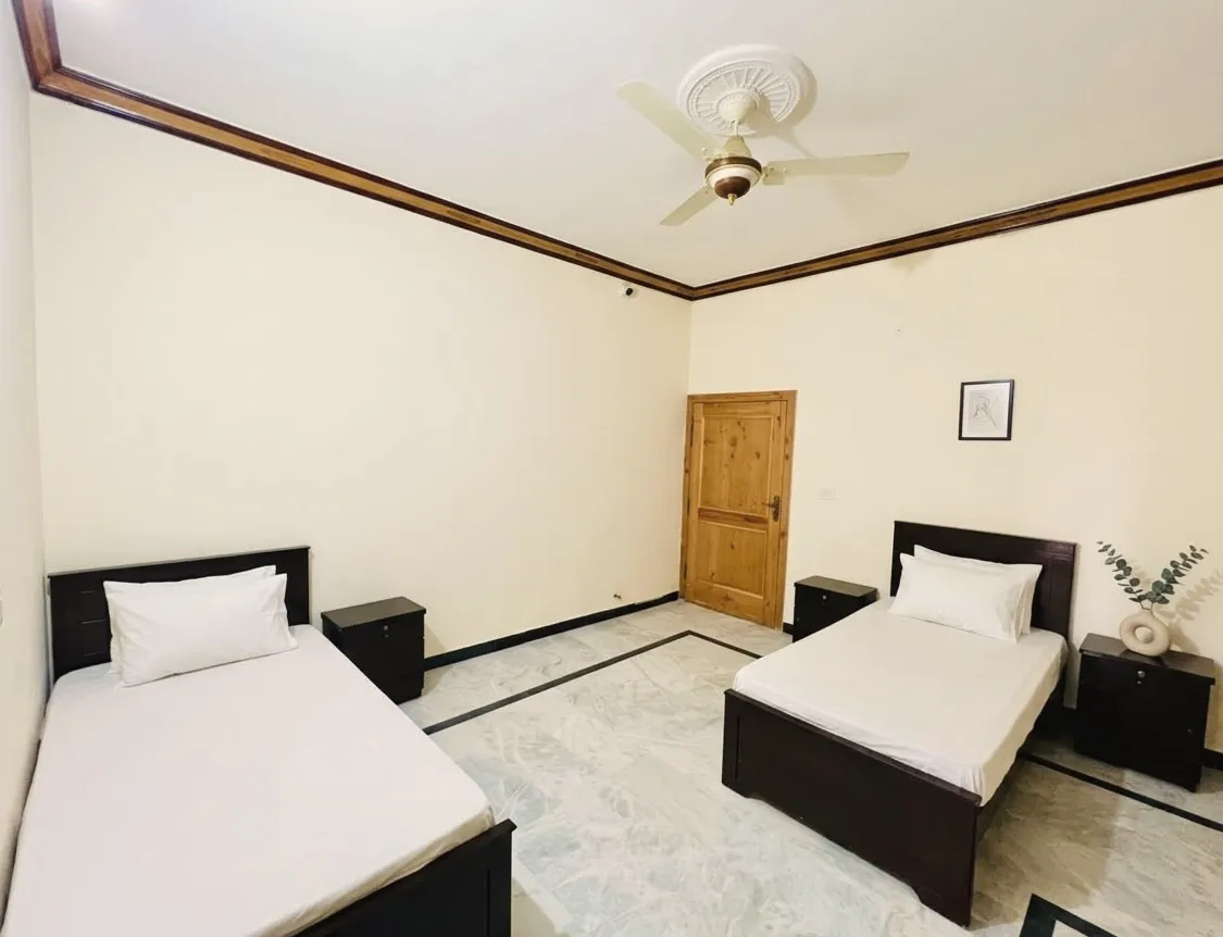Two-bed room with bedside tables